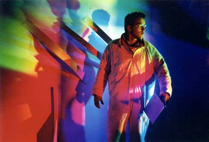 Jim Sullivan stands covered in colored shadows in Erskine's California studio before the S.O.S. Rome show.