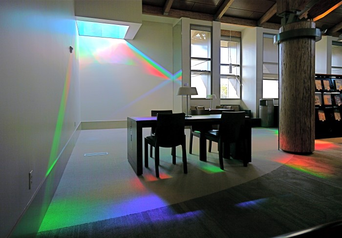 Library reading room with purple and green rainbows on floor. Erskine Solar Art