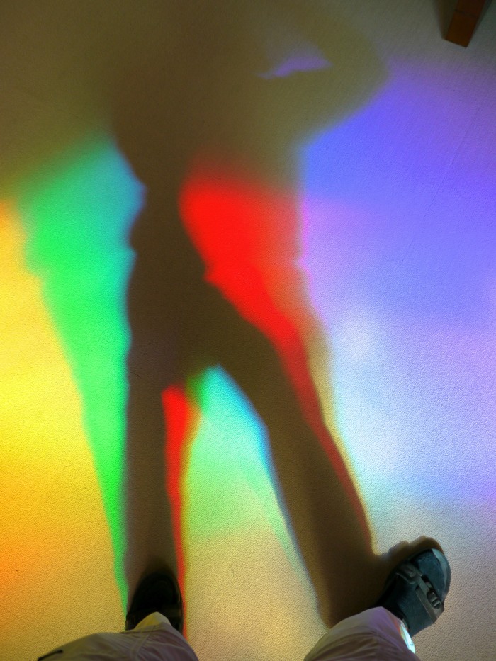 A library visitor creates his own living rainbow shadows!