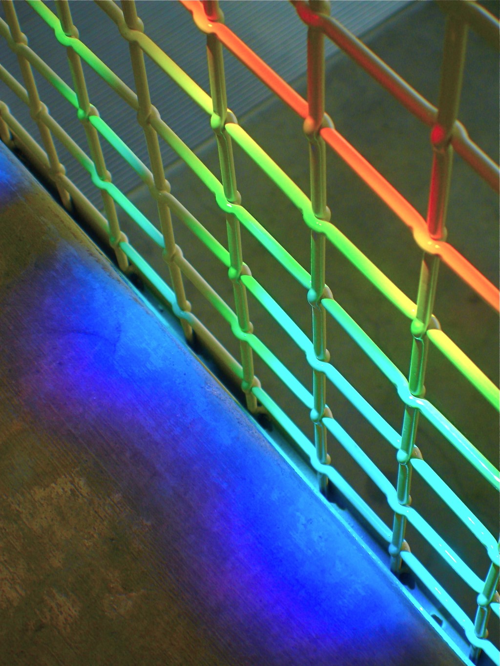 Detail of rainbow light sculpture on wire mesh in lobby. Erskine Solar Art