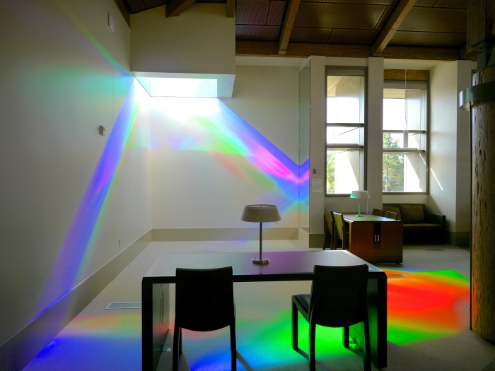library reading room is splashed with green, blue and magenta solar spectrum light. Erskine Solar Art