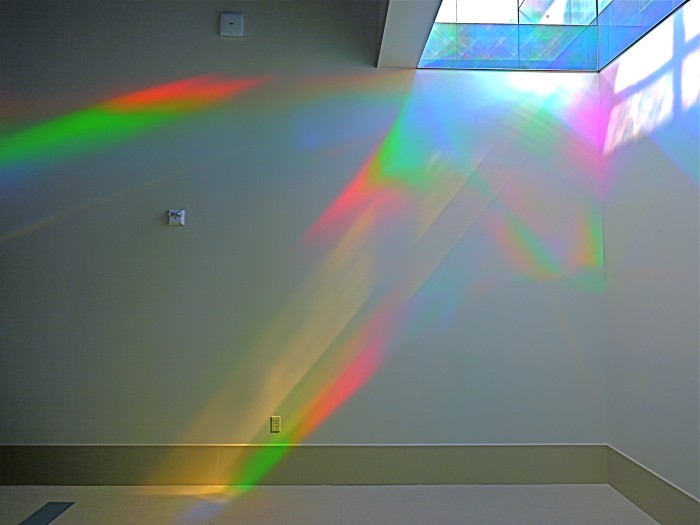 solar spectrum light painting on wall of library rainbow art installation. Erskine Solar Art