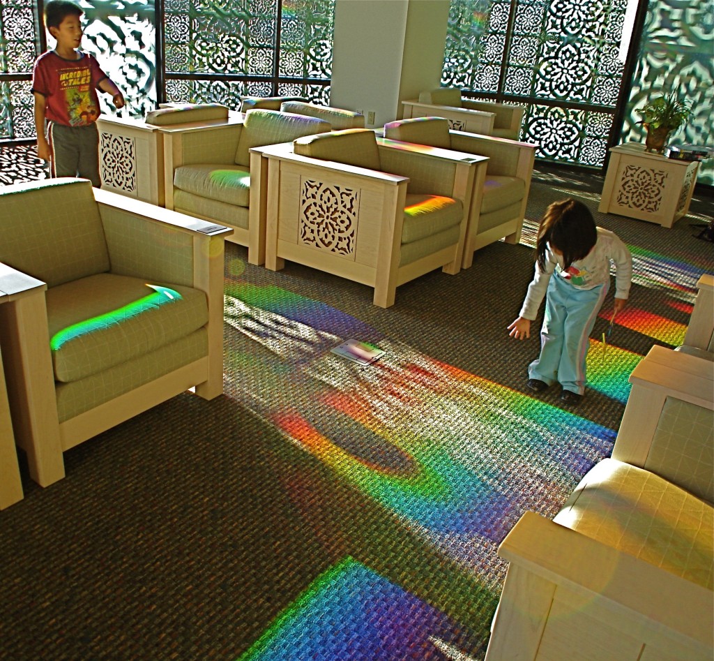 children play in library's solar powered art.