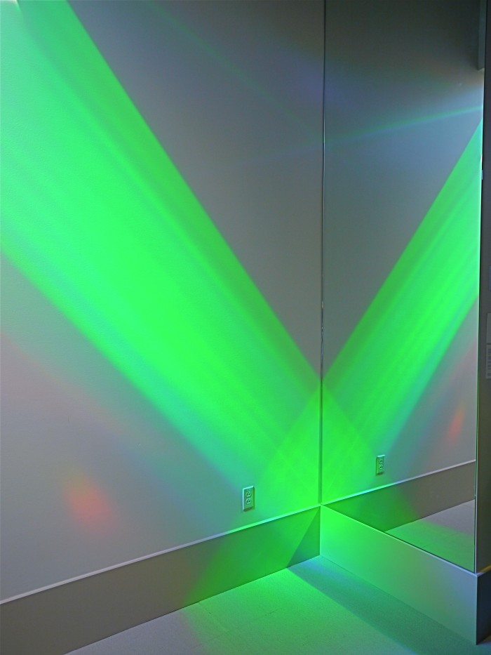 green slab of rainbow light art in library rainbow art installation wall. Erskine Solar Art