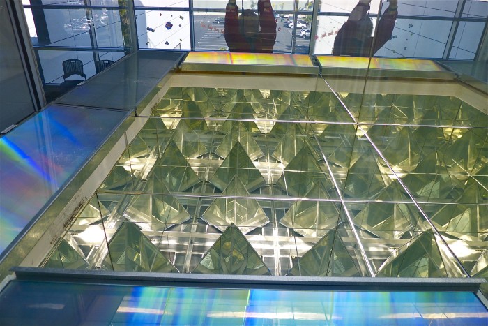 mirrors and flat prisms refract rainbow light in solar shaft. Erskine Solar Art